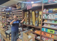 Owner among the cigar shelves